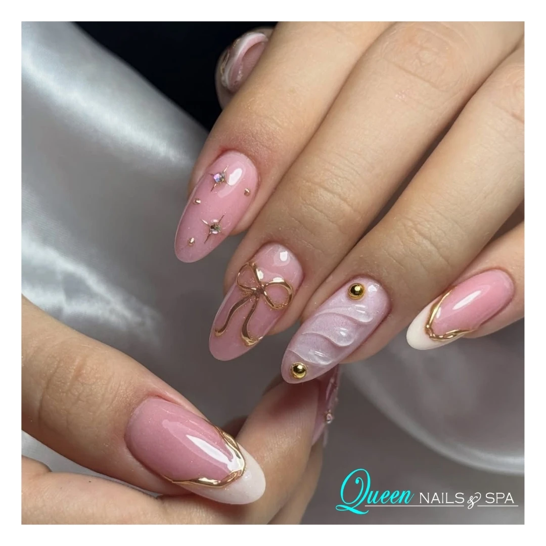 Queen Nails blush manicure with golden nail art details